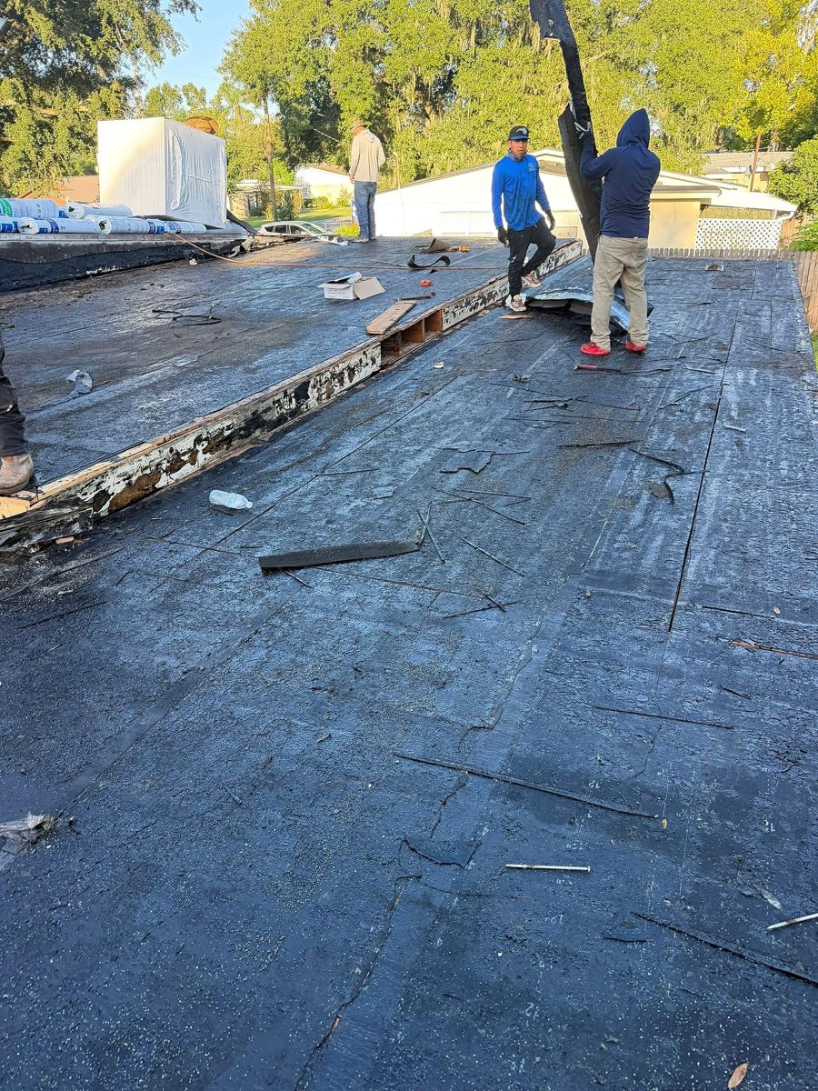 Roof deck edge exposed during a flat roof tear-off