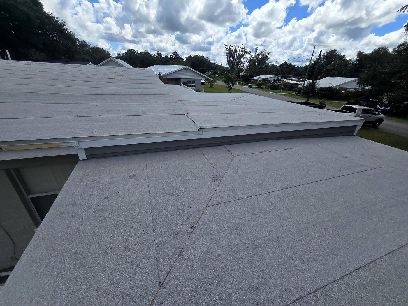 Finished flat roof with a gray membrane and clean edge metal