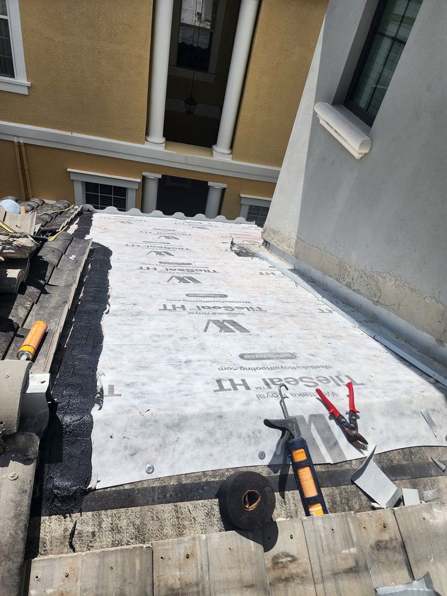 Tile underlayment installed on a tile roof section